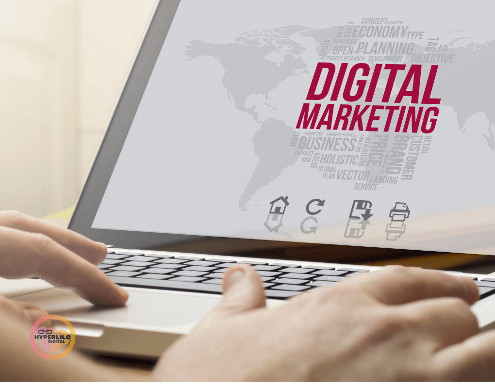 laptop with a word digital marketing and a human typing